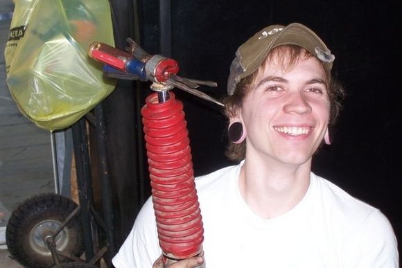 Someone get this kid a screwdriver!