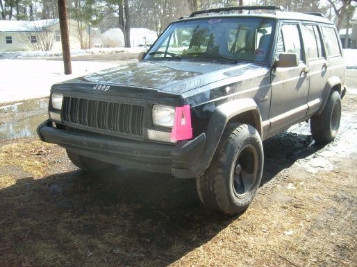 My most recent pic :-( In February, I hit a dog and now my bumper is jacked up, fender bent, and my turn signal don't work. The black lab charged at the jeep and the road was icy, nothing I could've done. I found out from the owner's neighbor that it was mean though.