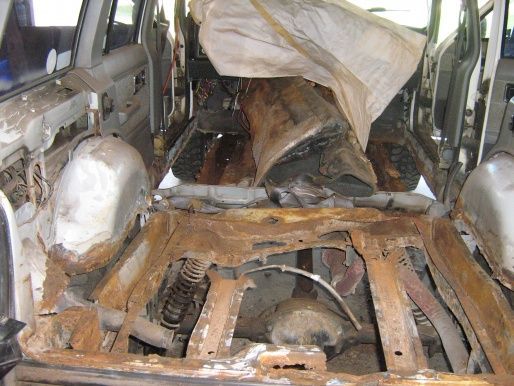 Tarp into the dash, get some floor metal out of the way. Sore bones on this rig