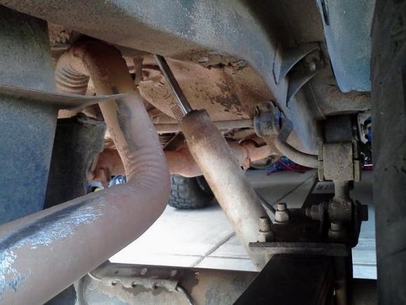 exhaust doesn't look right, and will probably need to be re-run. Pulled the rear sway bar out already. Front bushings ont he leaf springs need to be replaced.