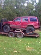 red jeep..a little banged up.. but thats just love