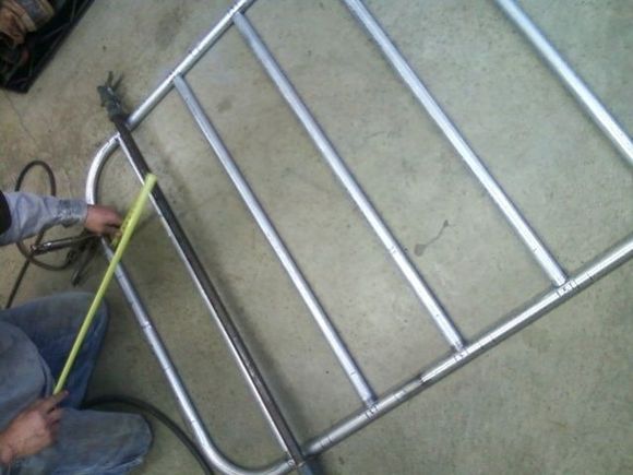 Used a truck bed retaining bar to clamp it together