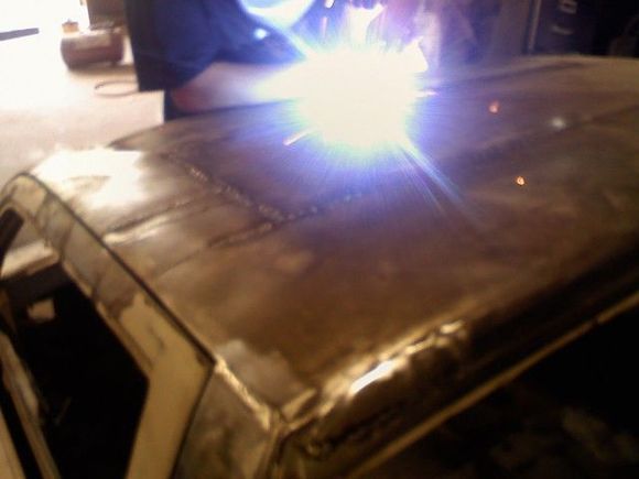 finishing up the tig welding on the chop top.... getting ready for some mud (body filler in this case)