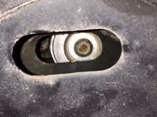 The serpentine belt tensioner bolt should be like this in the middle of the slotted hole in the passenger side fender well. 