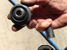 The lower bushing is an OEM bushing