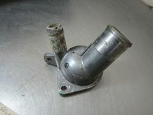 Old thermostat housing has the port on it, this would be for the oil cooler on 2.0 SS and earlier 2006 2.4 Ecotec engines 