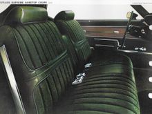 I always used the door pull strap, over there in the fake wood grain insert