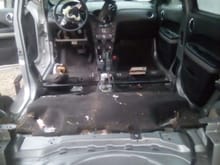 Yanking the interior out of the donor car.