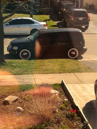 Those wheels are now on this black panel, with wide white walls!