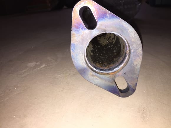A 3/8 thick flange with a full 2 inch hole not the 1 3/4 inch OEM hole in the flimsy 1/8 factory flange