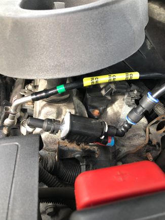 Up under the hood , I routed the new lines up to the fuel pie on the fuel rail and connected the fitting, then the vapour line , the instructions tell you to cut the old line an use the supplied coupler in the hose , that piece with the blue rings.