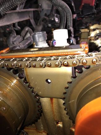 For reference, this was the slack in my 2011 2.4 , that was enough to bust up the front guide and set a code P0016. 
This chain kit was from Evergreen, the parts all had GM part numbers, the bags for the chains also had GM numbers in the label. This was just 20,000 miles of normal driving. No need to look any further then just removing the valve cover! 
Order the parts , start tearing the engine down!
Don’t order cheap junk off flea bay! 