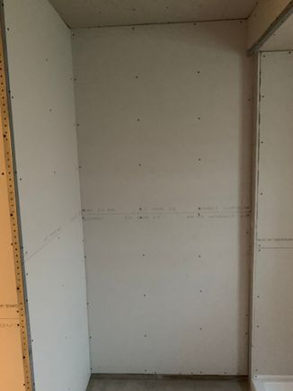 This area, by the shower, done! The towel rack will go on that wall, over there