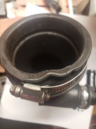 Yes this photo is from post #33, see the cracks in the rubber, possibly there are more severe cracks at the other end ?
Possibility this elbow needs to be replaced. 