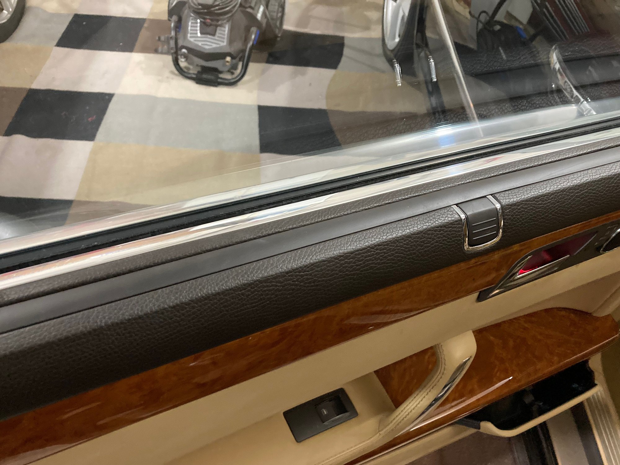 The sun shade handle has a metal insert on each side and sits in a click retainer metal seat when folded 
