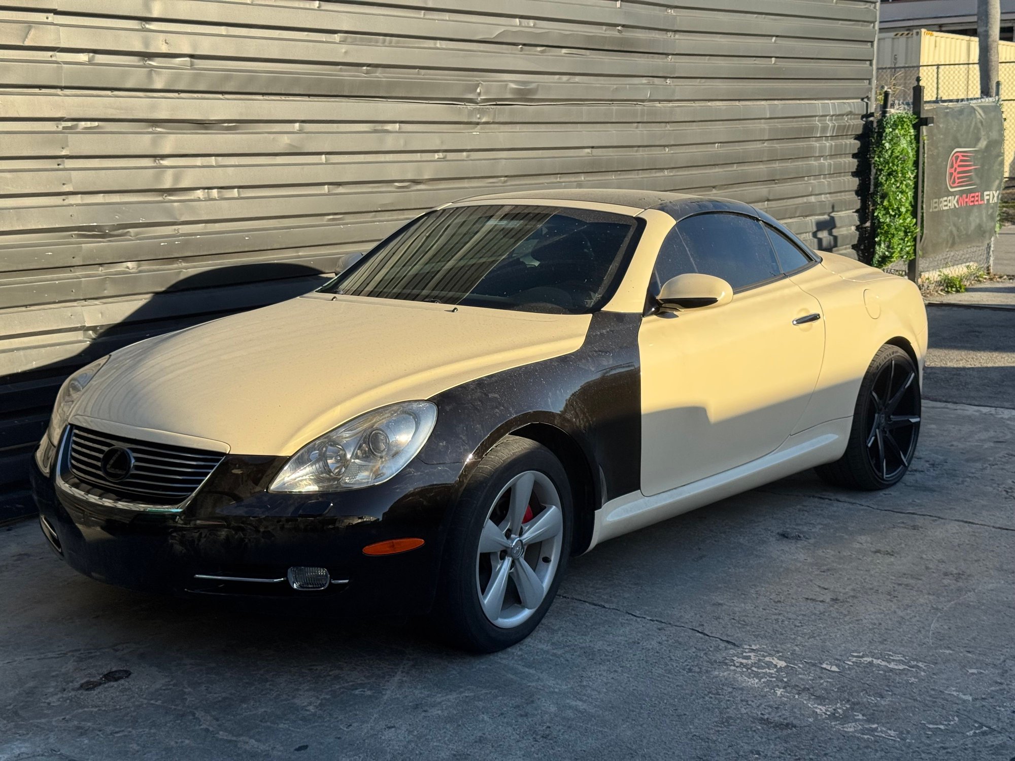 Car with replaced fender and bumper cover prior to them being rewrapped.  Temp wheel and tire to enable car to be driven.  Note there was no chassis or suspension damage discovered upon closer inspection.