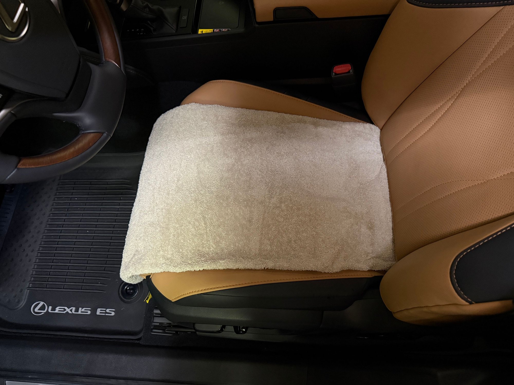 Added a towel to raise the seat bottom hoping to sit on top of the side bolsters