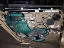 I've never seen such a busy door.  The air bag setup with what look like stainless steel air lines was interesting.   I removed the speaker to install the adhesive. 