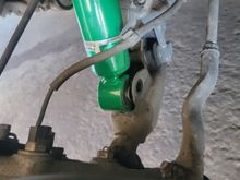 One bolt in the bottom of the strut. Use a hydraulic jack to hold the bottom of the shock