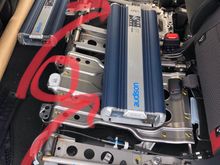 It is super easy to pop off the bottom back seat.

Have a look at my picture here to show you where the two clamps are - from the front of that seat at those spots just tug it up and once they release you can take off the whole seat in a matter of really seconds.