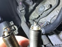 Left spark plug is broken , right is brand new 