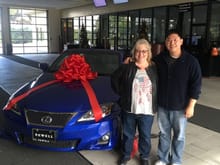 My wife with salesman Kevin Chou. He spent his day off Friday January the first picking us up from the airport and delivering our Ultrasonic blue F sport