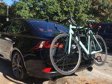 Got the allens sports deluxe bike rack for the whip at walmart. Doesnt scratch the car, because in reality it all depends how you strap on the bike to the trunk. Its a two bike rack i usually have my bike on and also my girlfriends cruiser bike on it. No issue. Love it.