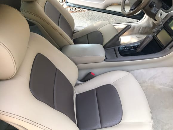 Custom 2 tone leather seats with perforated inserts.