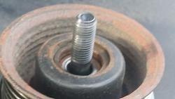 Too much tolerance between bolt and tensioner bearing