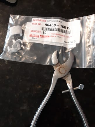 Hog ring pliers purchased from Mcmaster-carr.
Coated hog ring clips  # 90468-16019  from Lexus prevent rust stains.