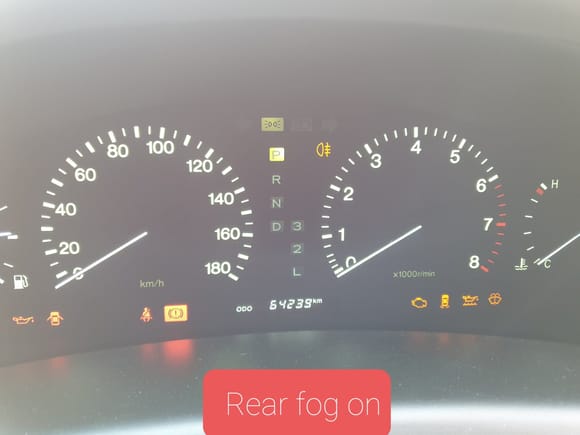 Meter image depicts the rear fog lamp icon to the right of the park icon. Tachometer and KPH Speedometer opposite to North American layout. There does not appear to be a fog lamp icon on the North American MPH based Meter.