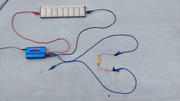 You cannot charge these modules as pictured. 
 They MUST be clamped tightly in a pack.  This is just a demo pic of how the circuit looks.  This is during charge 50 watt resistor is unplugged ( blue wire)