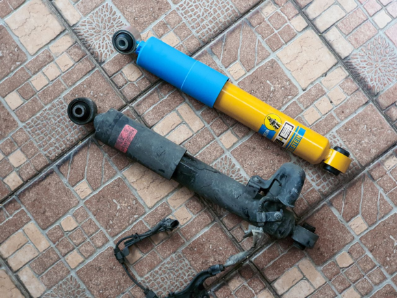 Factory AVS and Bilstein B6 rear dampers side by side.