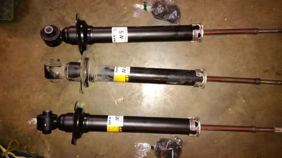 Ordered the OEM shocks from myLparts.com. They came with all new hardware included. Center strut is the old removed.