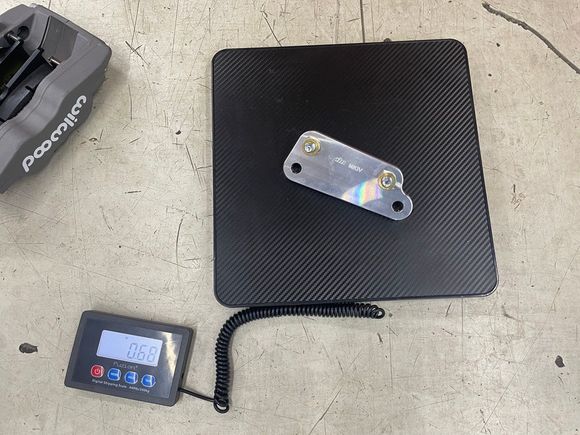 Supplied caliper brackets (MKIV Supra kit).  .68 pounds
