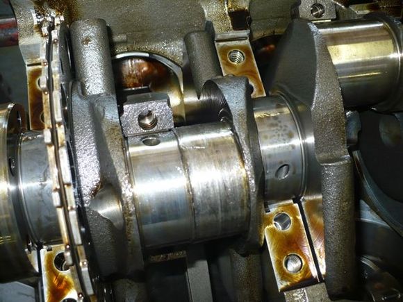 You can see the damage to the crank shaft from the connecting rod bearing being spun.