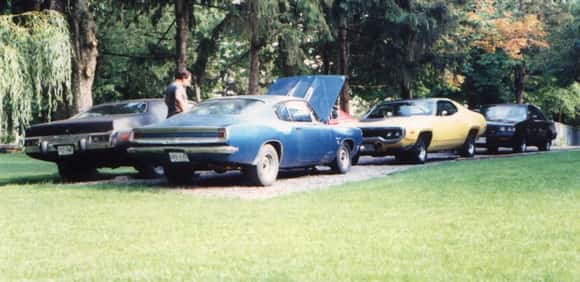 Our Yard, this was 1987, because my new Buick is in the yard now. I can still remember lining up beside my father at Cayuga  in his 68 340 Barracuda . It was going low 13's and we had a grudge match. He had no idea that this little turbo v6 could run the times  it was. He was convinced he would kick my ass. When we went through the traps and turned off the return road and I had one, he had the dumbest look on his face. Just threw his arms up in the air , like WTF just happened. LOL, I'll never forget that .That's him standing beside his newly acquired 68 383 Barracuda . RIP  Dad, I miss you .