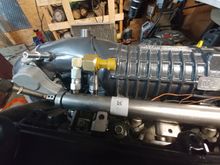 Found a 1/4 JIC Female to 1/8 NPT Female swivel fitting on Amazon to adapt AEM fuel pressure sensor to L61 fuel rail after removing Schrader valve.  PN: Eaton Aeroquip 2242-2-4S