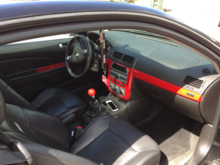 Had my inside panels painted red! The ss emblem got painted black! Got a custom shift knob made. Matches all perfect