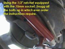 using ratchet to snug up bolts