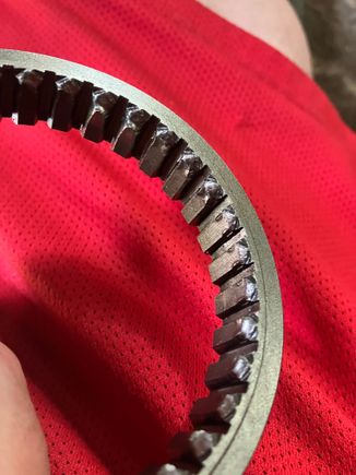 5th gear synchro sleeve teeth worn down.
