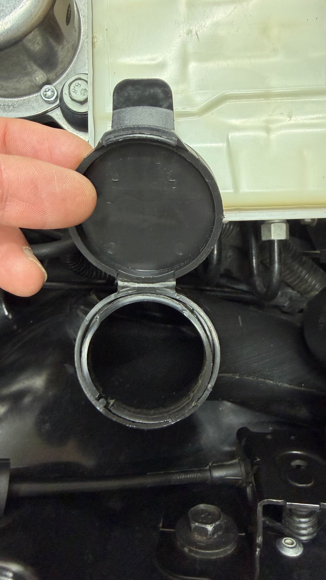 Cap open and attached to reservoir
