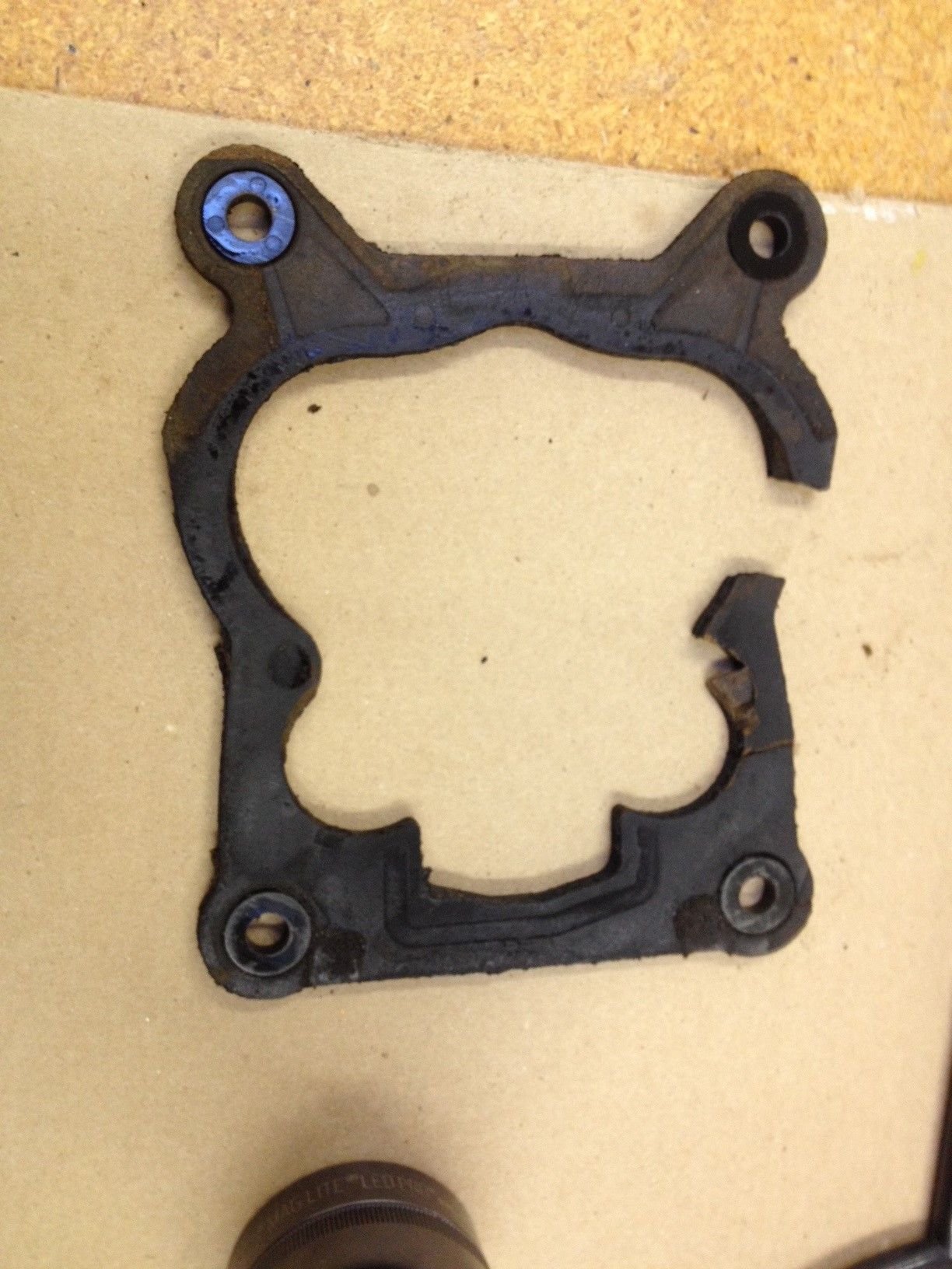 The large section missing broke off while I was scraping it off the manifold but there was a small piece missing....