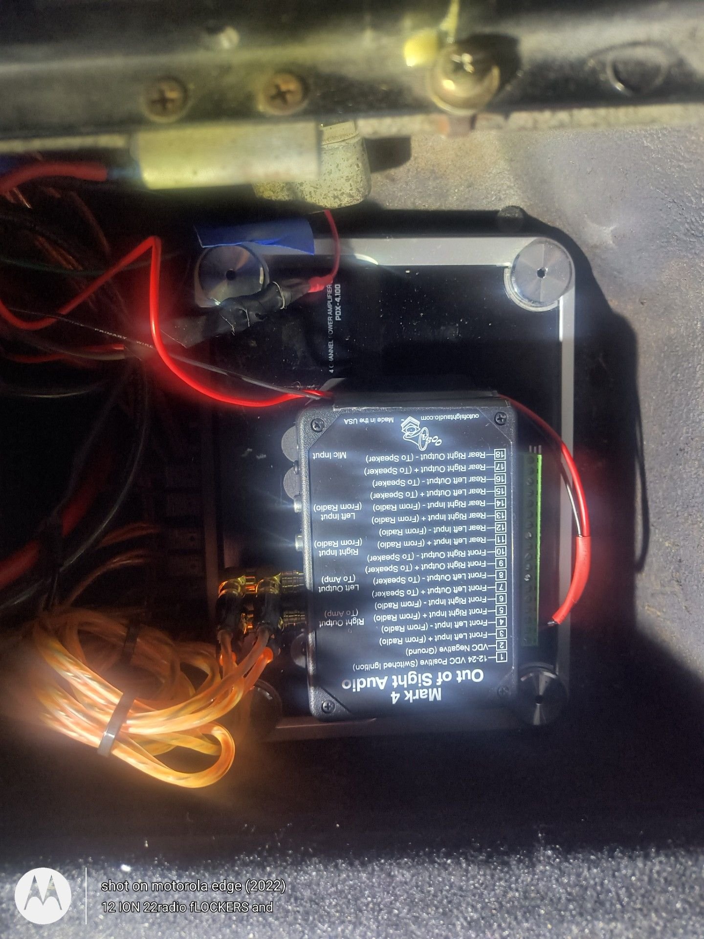 Bluetooth device mounted to the top of the pwr amp in that rear compartment