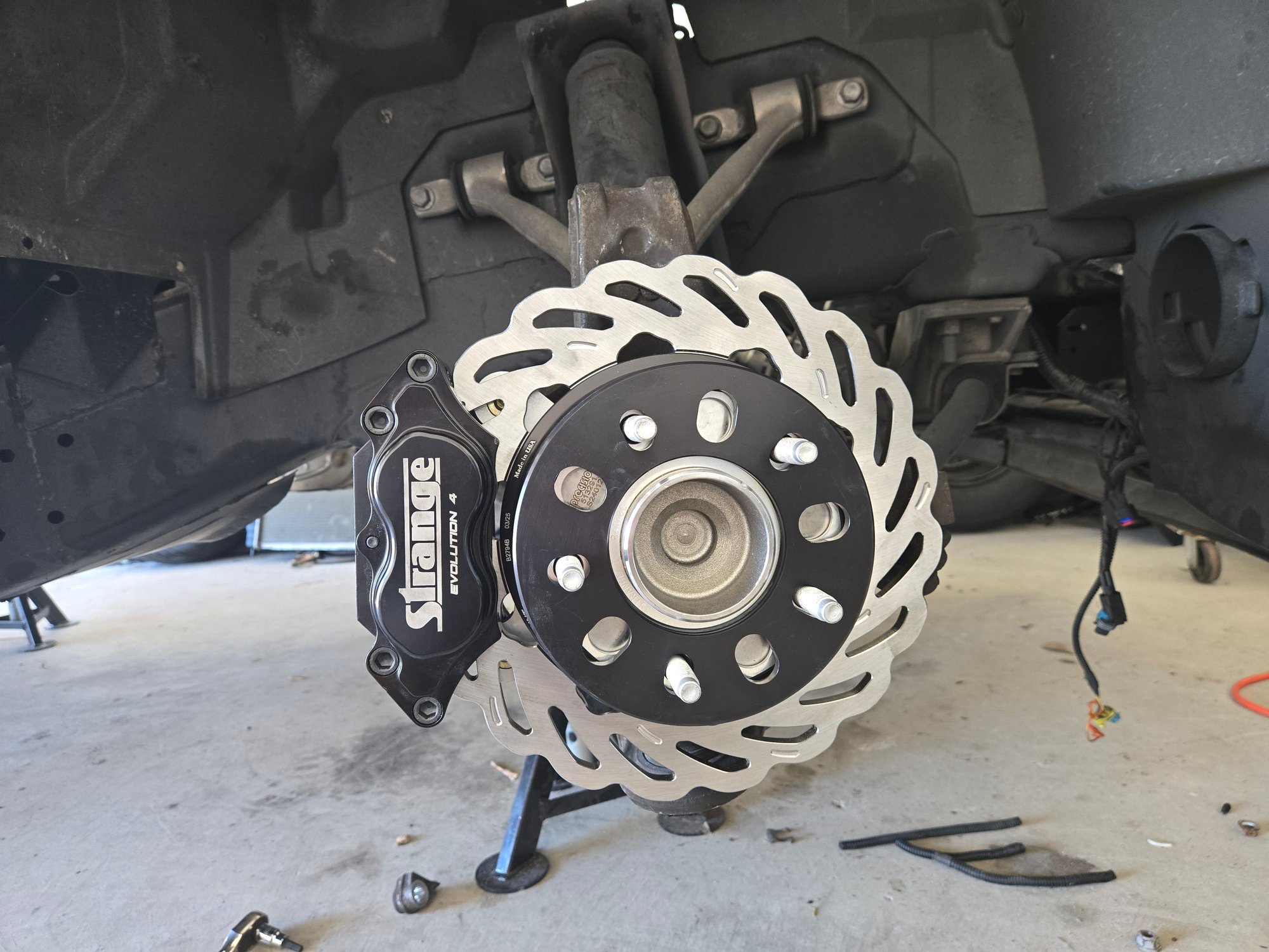 Got new hubs on the front and brakes installed all the way around...finishing line made a great product that installed super clean and easy...was a little more involved getting the spindles to accept the strange setup...looks good and should do the trick
