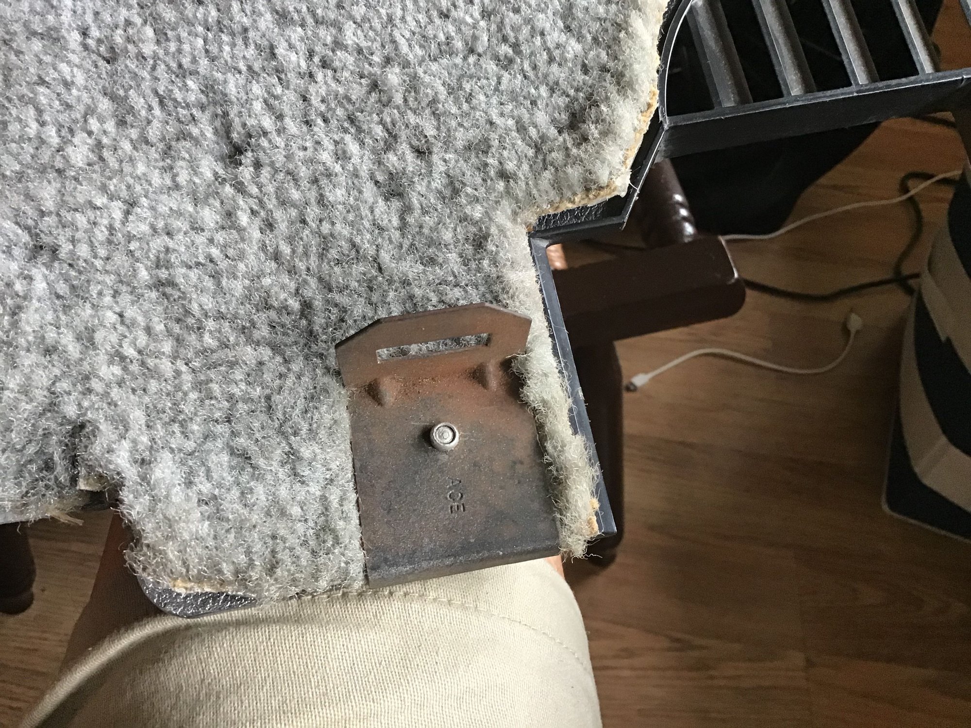 This is the bracket for light on kick panel,the head is round,hows it come off,grind head off.