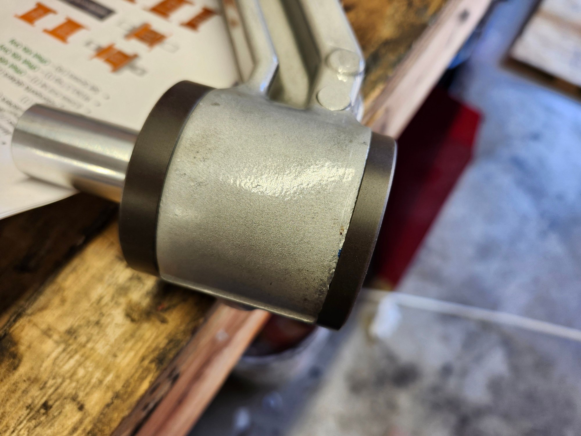 Narrow flange/long bushing on right/rear lwr mount outer