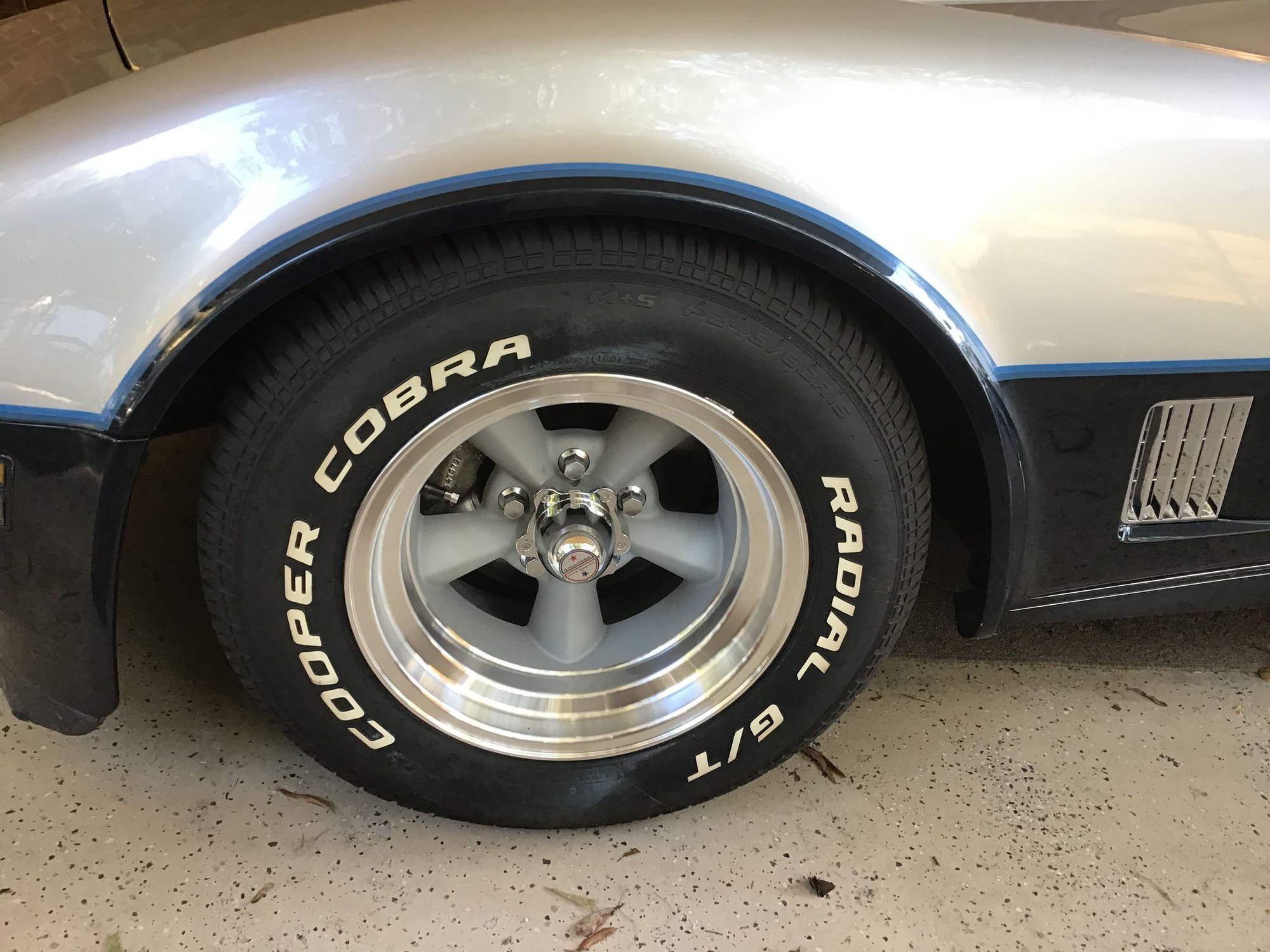 American Racing TTO.have to use a 7/16 or 10mm spacer to clear calipers,and they are 15 X 8 1/2 wide.