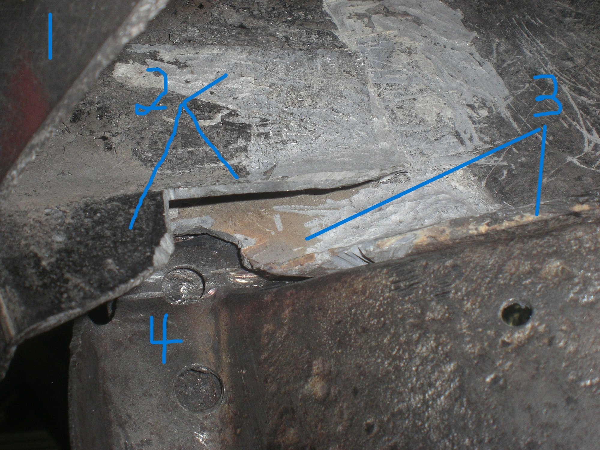 Close up shows 1 - fender cut, 3 - wiper trough and 4 - metal outer corner flange.  2 is the remaining portion of the bonding support piece after it was cut.
