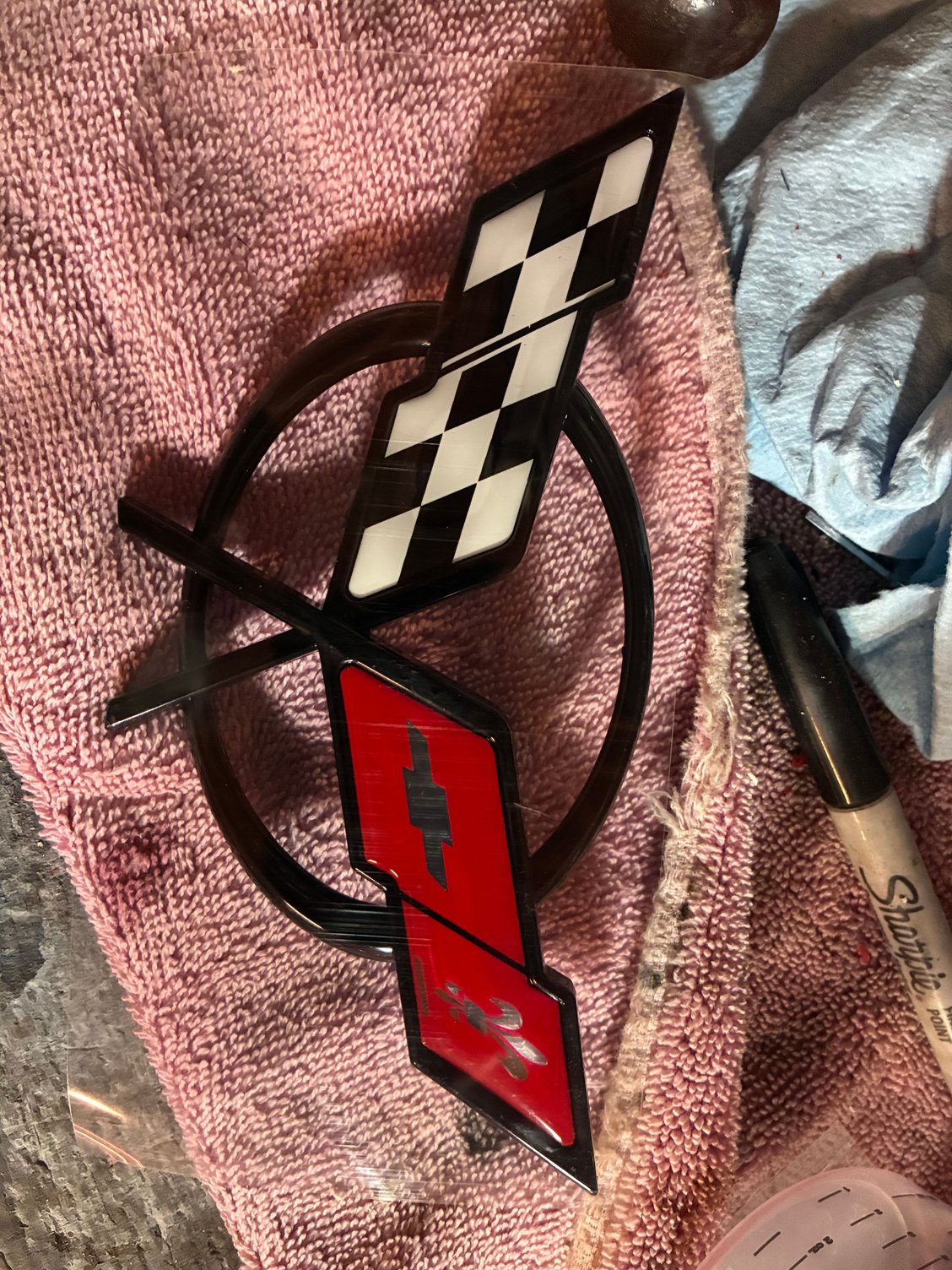 This is the badge im talking about. Should i sand before clear?